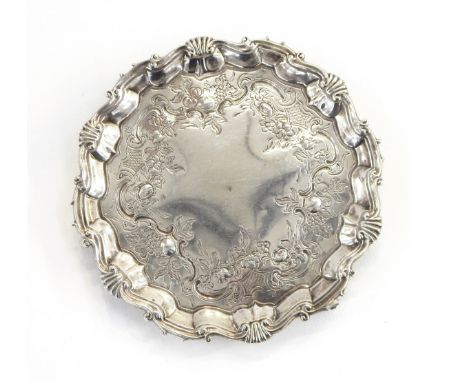 George II silver salver by William Peaston, London 1754 of shaped circular form with shell and scroll border, on three scroll