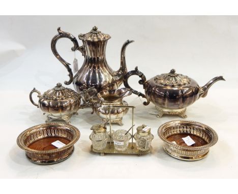 Quantity of silver plate including four-piece melon shaped tea/coffee set, pair of wine coasters and three bottle condiment s