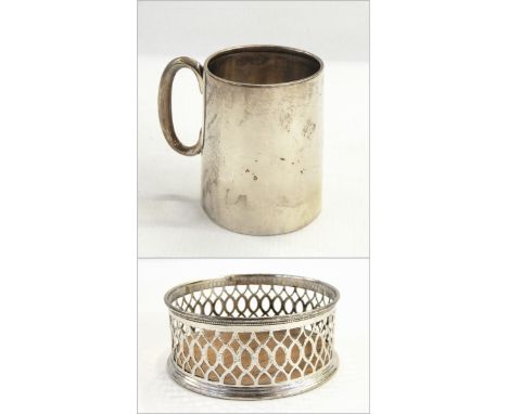 Silver mug, Birmingham 1928, of plain tapering circular form, 7.5cm high and small silver coaster, Chester 1902 of circular f