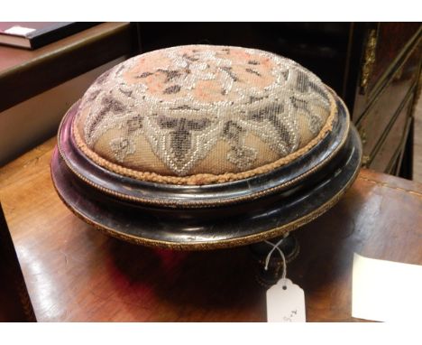 Pair 19th century circular ebonised footstools with tapestry beadwork inset tops, the shaped sides with applied metal border 