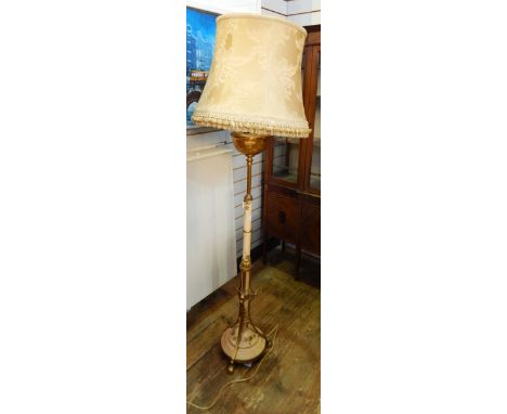 Brass and painted standard lamp converted from oil, the column decorated with gilt leaf and floral engraving, on scroll brass