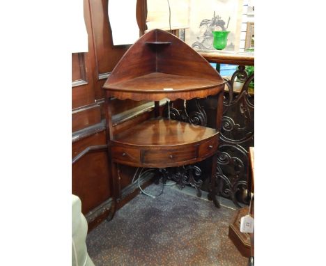 Mahogany corner washstand with removable top to reveal hole for basin, scalloped apron, the under-shelf with two short dummy 