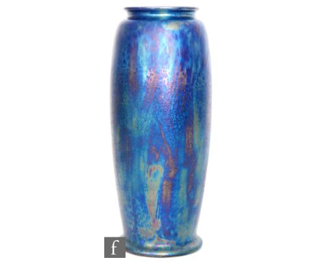 Ruskin Pottery - An early 20th Century Rolling Pin vase of footed swollen sleeve form decorated in a petrol iridescent Kingfi