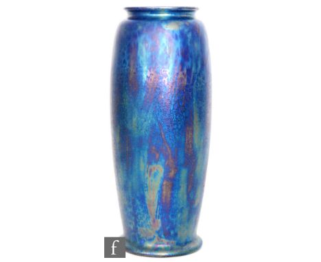 Ruskin Pottery - An early 20th Century Rolling Pin vase of footed swollen sleeve form decorated in a petrol iridescent Kingfi