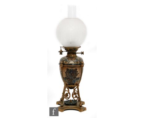 Mark V. Marshall - Doulton Lambeth - A late 19th Century stoneware oil lamp of ovoid form, decorated with dragons and foliate