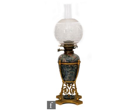 Mark V. Marshall - Doulton Lambeth - A late 19th Century stoneware oil lamp of ovoid form, decorated with owls and mythical b