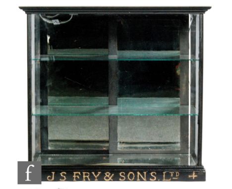 J.S Fry &amp; Sons Ltd -A late 19th Century ebonised counter shop display cabinet with two tier fitted shelf interior above a