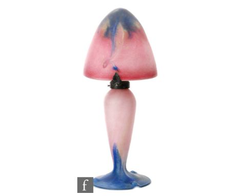 Le Verre Francais - An early 20th glass table lamp with a domed tonal blue to pink shade with green polychrome inclusions on 