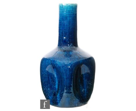 Christopher Dresser - Linthorpe Pottery - A late 19th Century vase, of bottle form with five concave sections to the body, wi