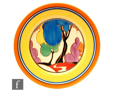 Clarice Cliff - Blue Autumn - A circular plate circa 1931, hand painted with a stylized tree landscape within orange, black, 