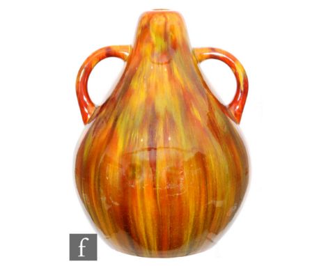 Attributed Linthorpe Pottery - A late 19th Century vase of bulbous pear form, flanked by twin tubular handles, with all over 