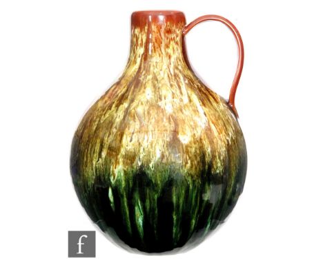 Christopher Dresser - Linthorpe Pottery - A 19th Century ovoid form jug, applied with short loop ribbed handle, with all over