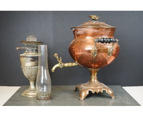 An antique copper Samovar with brass fittings together with a vintage oil lamp. 