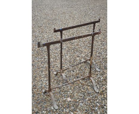 A pair of vintage wrought iron table trestles. 