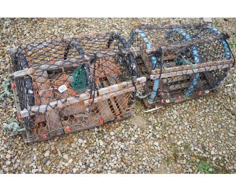 A pair of vintage lobster pots. 
