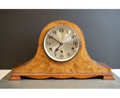 A vintage German wooden cased chiming mantle clock. 