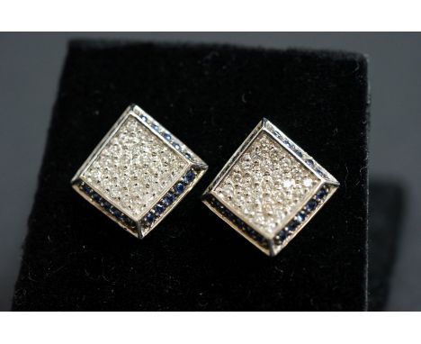 Pair of 14ct white gold pavé set sapphire and diamond earrings 