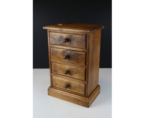 Pine four drawer table top chest 