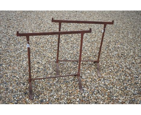 A pair of vintage wrought iron table trestles. 