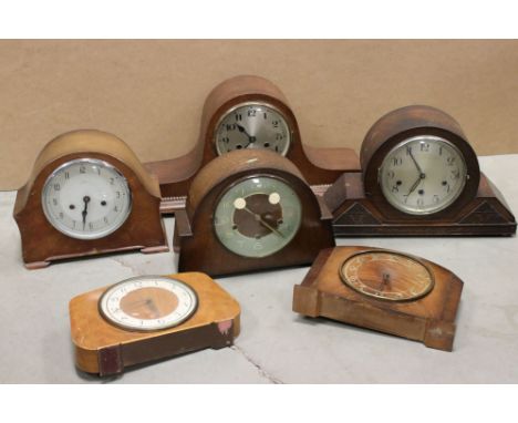 A collection of six vintage wooden cased mantle clocks.