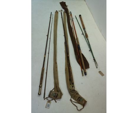 Sealey 'Black Arrow' fibreglass two-piece spinning rod, a 'Toko' fibreglass two-piece sea fishing rod and a Milbro two-piece,