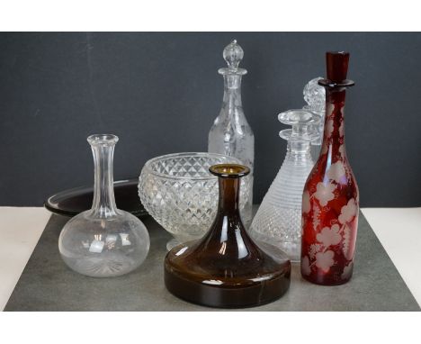 A collection of vintage glass decanters together with two glass bowls. 
