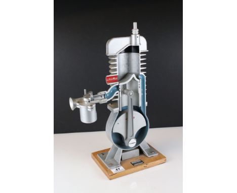 Cast Cut-away Demonstration Model of a Two-stroke Engine by Irwin &amp; Partners Ltd of Croydon, on wooden plinth, 45cms high