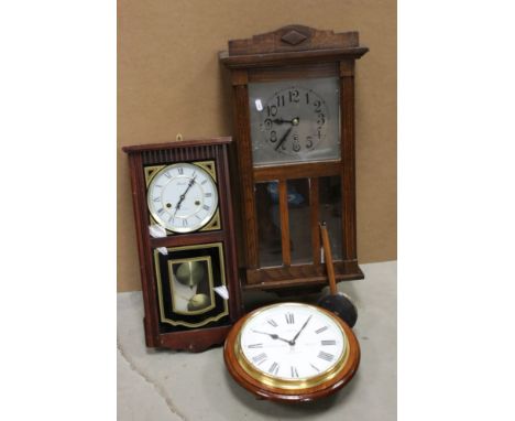 A vintage oak cased wall clock. 