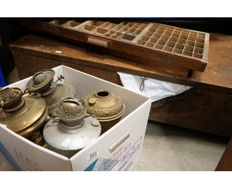A group of mixed collectables to include printers trays, vintage oil lamps and a large wooden box. 