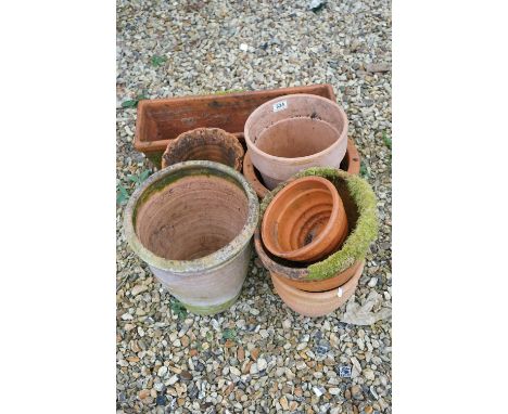 A collection of vintage terracotta garden plant pots. 