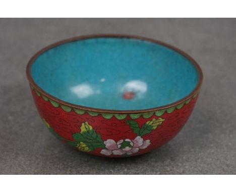 A vintage oriental cloisonné bowl with floral decoration. 