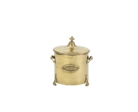 REGENCY STYLE TWO HANDLED BRASS COAL RECEIVER AND COVER, of cylindrical form with scroll handles and feet, 16" (40.7cm) high,
