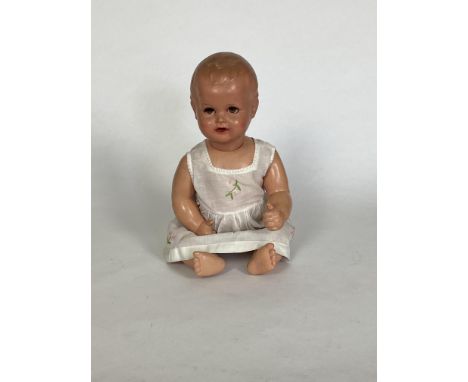 Three vintage German dolls
Comprising a 1920's celluloid doll with turtle mark (head repainted), a 1930's doll with turtle ma