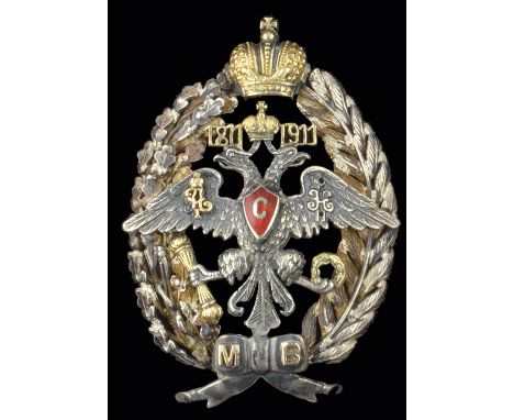 Russia, Local Troops Centenary Badge, 1911, in silver, silver-gilt and red enamel, by Ã.Ê, Moscow, width 37.2mm (P.B. vol. II