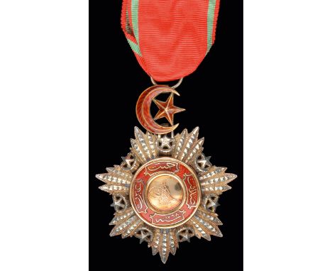 Turkey, Order of Medjidjie, Fourth Class badge, in silver, with gold and red enamel centre, width 56.5mm, test scratch on rev