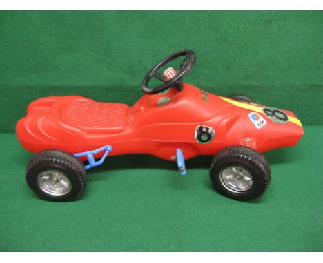 Childs plastic pedal racing car with chain drive to rear axle, steering and horn, sticker on scuttle reads Falk Depose Deluxe