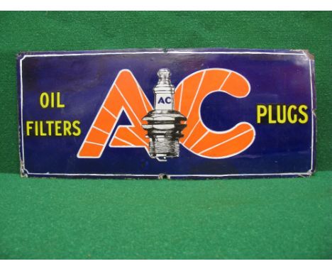 Enamel advertising sign for AC Plugs and Oil Filters featuring a large central spark plug illustration - 21" x 9"
