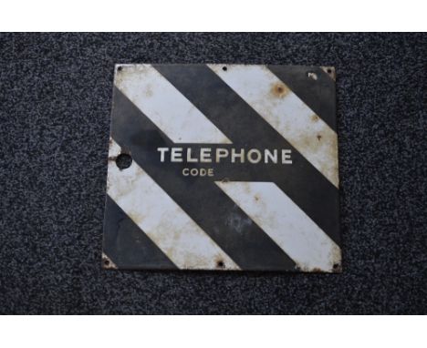 Enamel sign for Telephone Code, white letters on a white and black striped ground - 16" x 15"