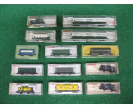 Fleischmann, eleven N gauge Continental wagons, boxed together with a Minitrix and one Peco bulk grain carrier