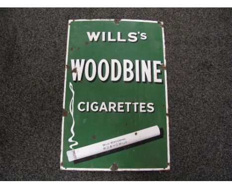 Enamel advertising sign for Will's Woodbine Cigarettes featuring a large smoking cigarette with the words Wild Woodbine WD&HO