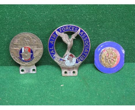 Three car badges, one for the Royal Air Forces Association, one featuring a St Christopher with enamel Royal Air Force centre