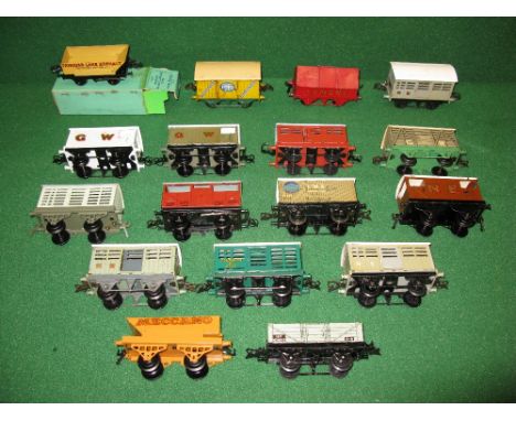 Hornby O gauge, seventeen tinplate four wheel wagons and brake vans to include: GW, Milk, LMS Banana, three NE Cattle, BR Cat