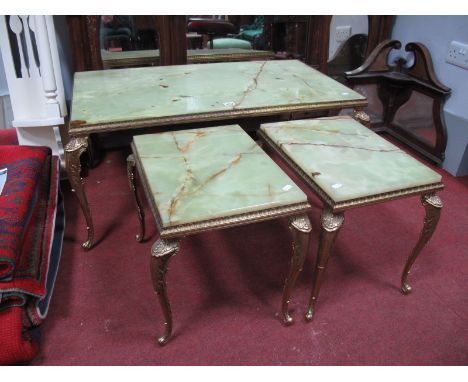 A XX Century Rectangular Shaped Onyx Coffee Table, on gilded brass carbiole legs, together with a pair of matching lamp table