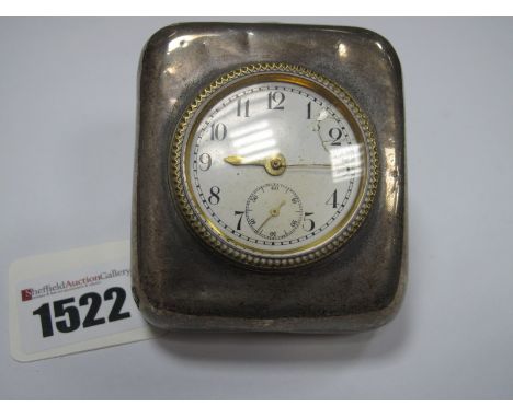 A Hallmarked Silver Mounted Clock, the white enamel dial (damaged) with black Arabic numerals and seconds subsidiary dial, wi