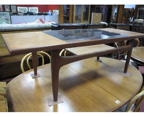 G Plan Teak Coffee Table, circa 1970's with glass inset top and magazine shelf under with label and number 2473, 137cm wide.