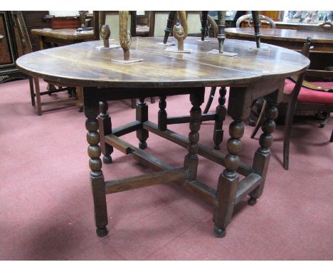 A Late XVIII Century Joined Oak Gateleg Table, with bobbin and block supports.