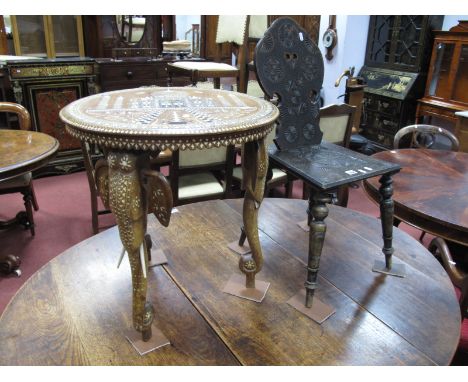 An Indian Inlaid Table,the top with an Indian Temple, on elephant head and trunk legs, (with label made in British India), to