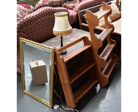 A bevelled glass mirror with gilt frame, turned wood lamp and shade; and two hanging pine shelves