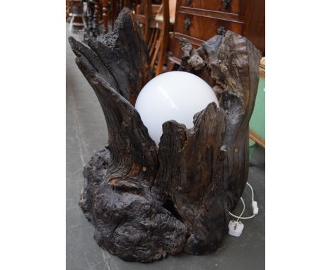 An unusual lamp in the form of a tree trunk