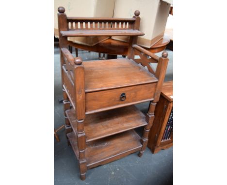 A side table with drawer and two undershelves, and a shelf above